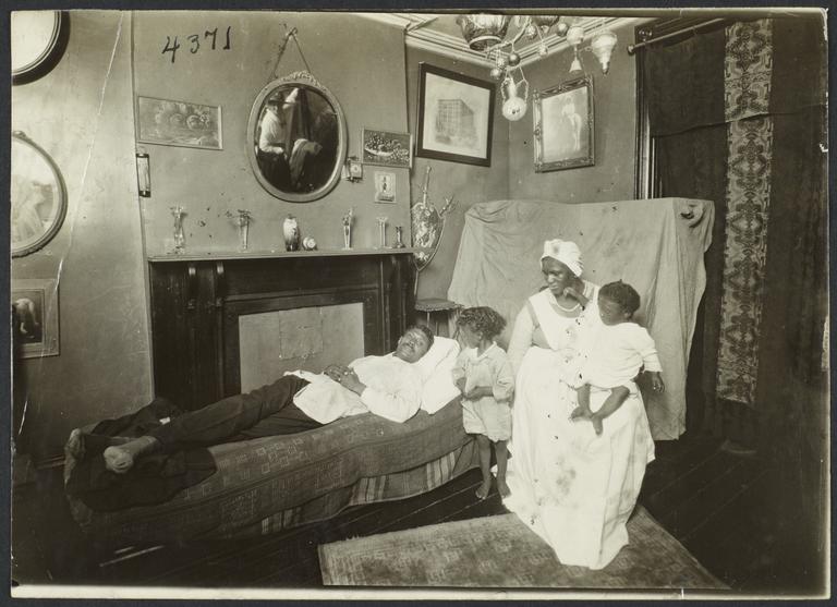 Columbus Hill Health Center Album -- Man on Sofa with Family
