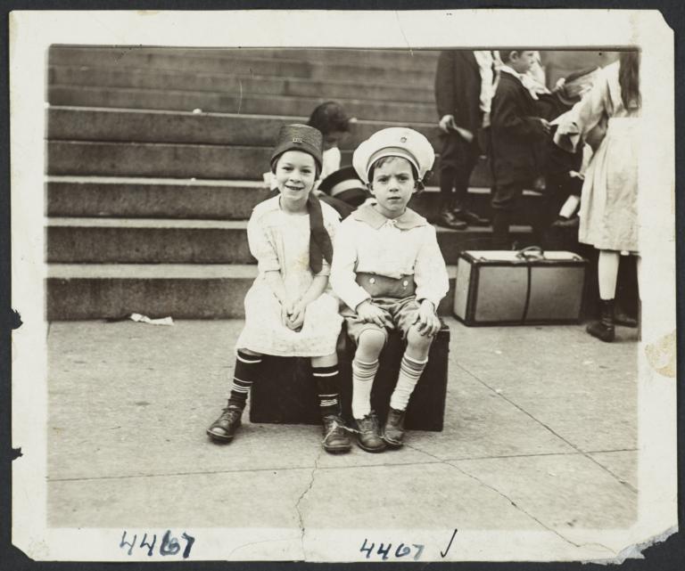 Children Sitting on Suitcase