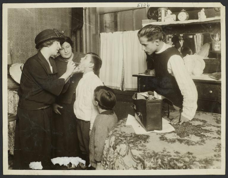 Mulberry Health Center Album -- Nurse Checking Boy's Throat
