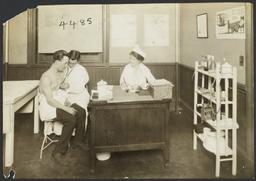 Mulberry Health Center Album -- Doctor Checking Heartbeat of Man