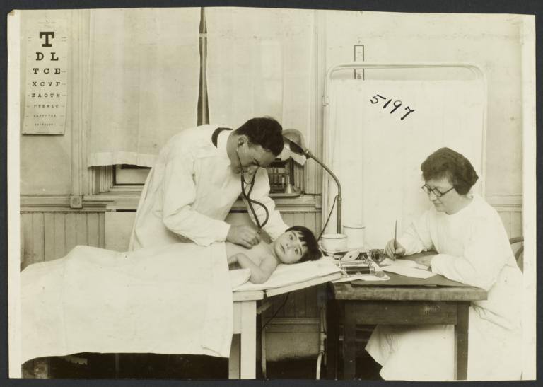 Mulberry Health Center Album -- Doctor Examining Child