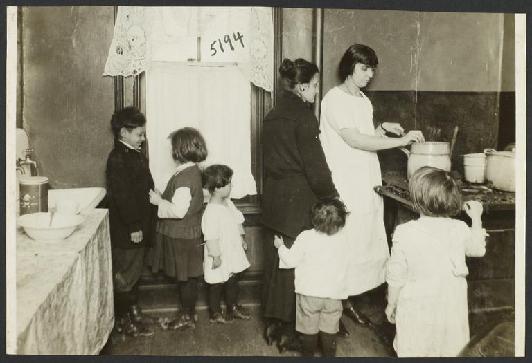 Mulberry Health Center Album -- Women with Children in a Kitchen