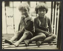 Close Up of Two Children on Fire Escape