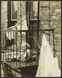 Child with Stuffed Animal on Fire Escape