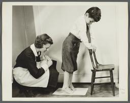 Nurses' Educational "Keep Well" Series Album -- Nurse with Child on Toes