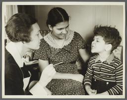 Nurses' Educational "Keep Well" Series Album -- Nurse Inspecting Teeth of Boy