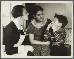 Nurses' Educational "Keep Well" Series Album -- Nurse Inspecting Eyes of Boy