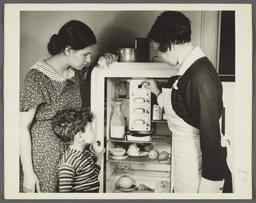 Nurses' Educational "Keep Well" Series Album -- Nurse Inspecting Refrigerator 