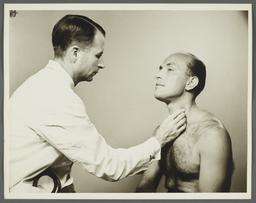 Health Examination-Men Album -- Doctor Examining Man's Thyroid