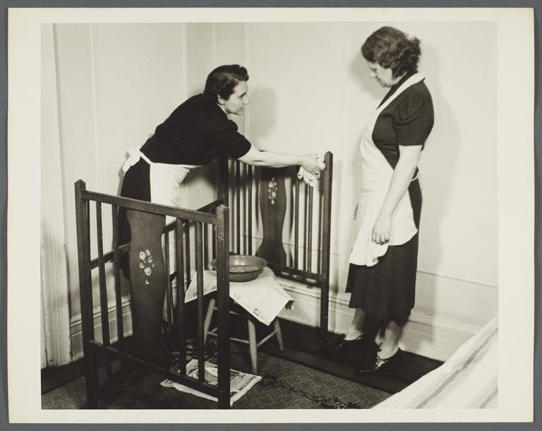 Nurses' Family Health Series: Tuberculosis Album -- Nurse Cleaning Crib
