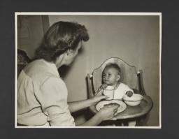 Picturing Some of the Principles of Child Care Album -- Mother Feeding Baby
