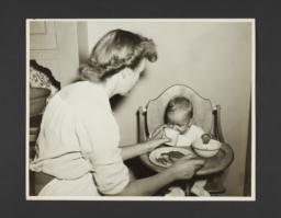 Picturing Some of the Principles of Child Care Album -- Baby Drinking from Cup