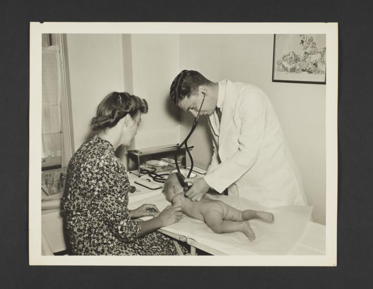 Picturing Some of the Principles of Child Care Album -- Doctor Examines Baby