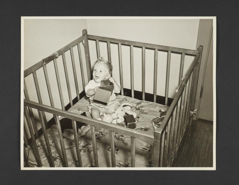 Picturing Some of the Principles of Child Care Album -- Baby in Playpen