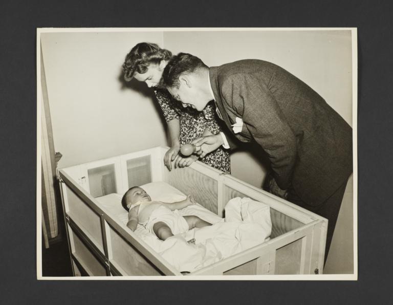 Picturing Some of the Principles of Child Care Album -- Father and Mother Watching Baby