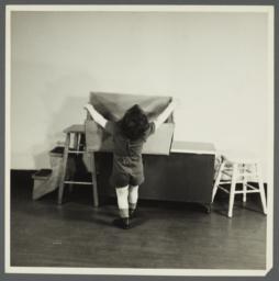 Lenox Hill, 1948-1949 Album -- Boy Reaching for Box
