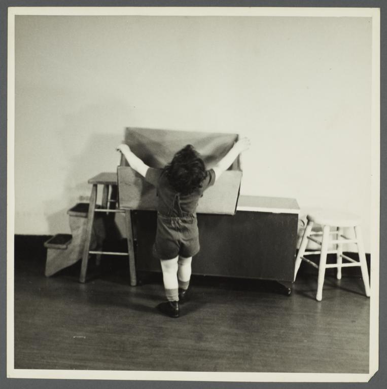 Lenox Hill, 1948-1949 Album -- Boy Reaching for Box
