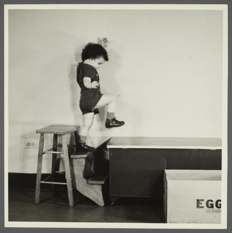 Lenox Hill, 1948-1949 Album -- Boy Stepping from Stool to Table