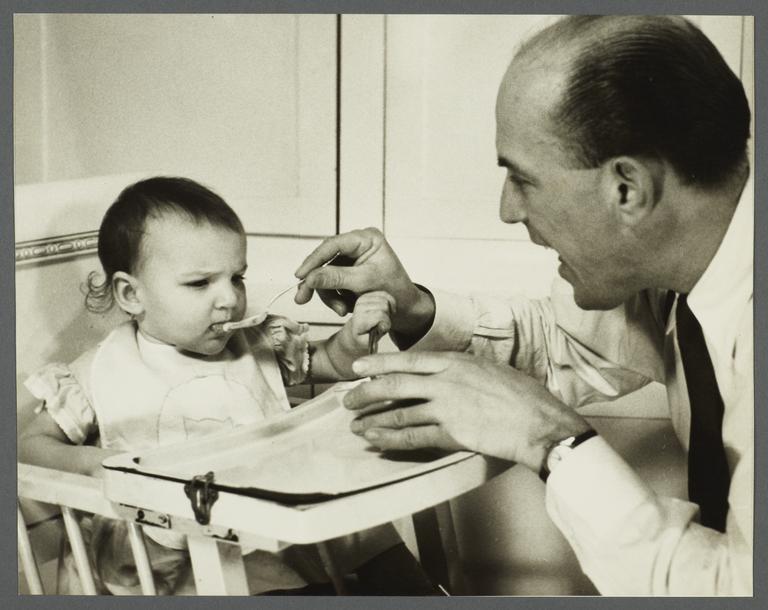 Lenox Hill, 1948-1949 Album -- Man Feeding Baby