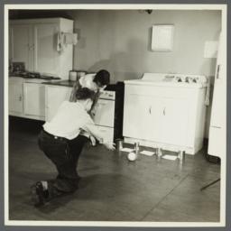 Lenox Hill, 1948-1949 Album -- Playing Game in Kitchen