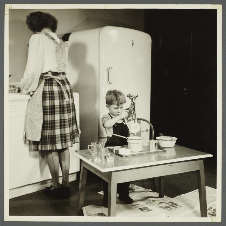 Lenox Hill, 1948-1949 Album -- Woman with Boy in Kitchen