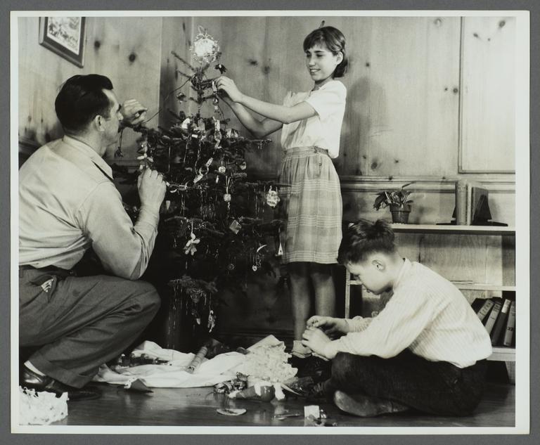Lenox Hill, 1948-1949 Album -- Placing Ornaments on Christmas Tree